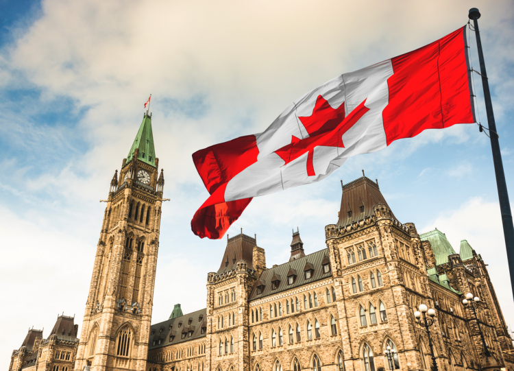 Parliament building and Canadian flag.